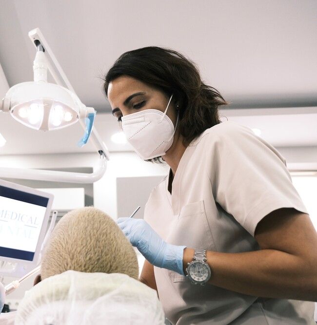 Dentist clean her patient teeth 