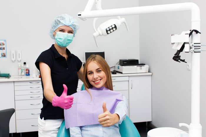 dentist and patients had a good teeth whitening in dental clinic