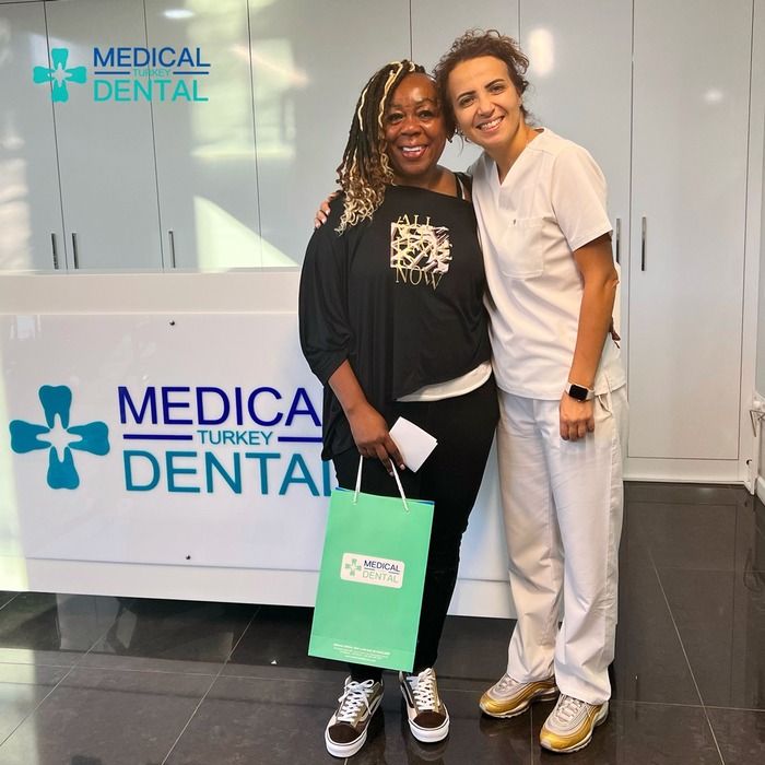 Dentist has photo with patient after white fillings